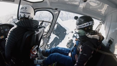 Angel Collinson in a helicopter going to the top of an Alaskan mountain.  (mandatory credit:  Teton Gravity Research)