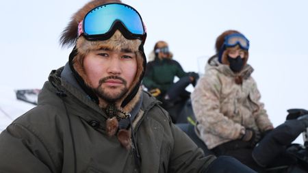 Avery Hoffman travels by snowmobile with his brother Gage in search of moose during the winter season. (BBC Studios Reality Productions, LLC/Jeffrey Alexander)