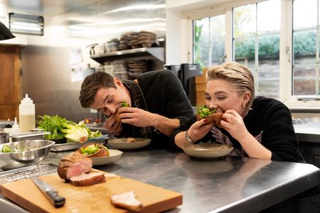 Antoni Porowski and Florence Pugh taste Yorkshire puddings and mutton chops. (National Geographic/Chris Raphael)