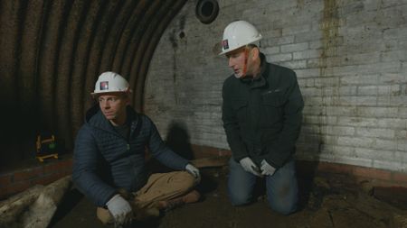 Arthur Williams and Andy Chatterton are pictured in a newly discovered secret WW2 bunker. (National Geographic)