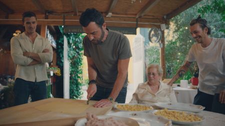 Antoni Porowski, Justin Theroux, Marissa Cotti and Riccardo Cotti make Tortellini in Brodo at Antica Osteria del Mirasole. (National Geographic)