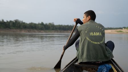 João-Pedro Mendes da Silva rows to a turtle nesting beach to start his shift patrolling the beach to protect it from poachers.  
(credit: National Geographic/Paulo Velozo)