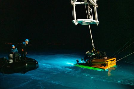 The OceanXplorer crew prepare the submarine for a night mission. (National Geographic/Patrick Hopkins)