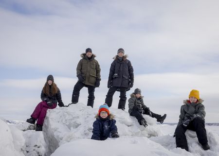 The Pelletier family (from left): Mia, Sebastien, Colin, Edith Lemay, Laurent and Leo in Kuujjuaq, Canada.  (Credit: National Geographic/Katie Orlinsky)