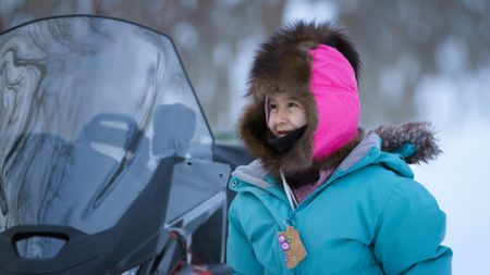 Maya DeWilde travels with her father Ricko as they look for places to set rabbit snares. (BBC Studios/Ryan Walsh)