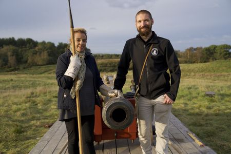 Alex Churchill poses por a portrait with Rob Bibbings of the Trafalgar Gun Company, after firing a replica canon of the type used on HMS Victory during the Battle of Trafalagar. (National Geographic/Jahlani Clarence)