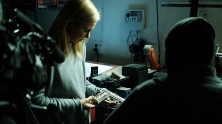 Mariana van Zeller inspects one of Tony's ghost guns. (National Geographic for Disney)