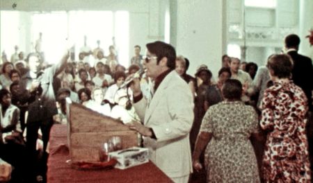 Jim Jones addresses his congregation from the pulpit in California. (California Historical Society)