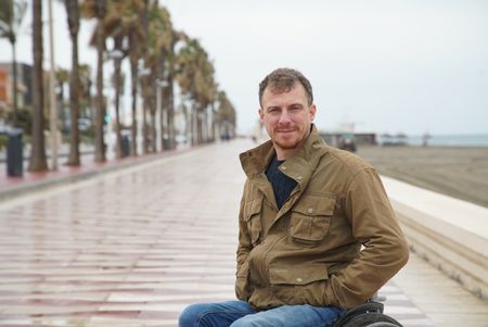 Arthur Williams talks about the Spanish Civil War, at Almeria beach, in Spain. (National Geographic/Ciaran Henry)