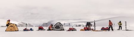 Alex Honnold and his team build their camp on the Renland Icecap in Eastern Greenland.  (photo credit: National Geographic/Pablo Durana)
