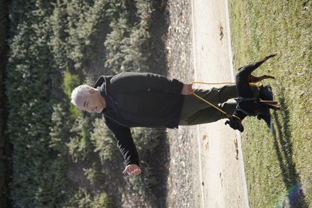 Cesar with Alpha on a leash. (National Geographic)