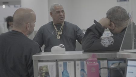 CBP Officer Bono and a fellow Spanish speaking officer are questioning a traveler who missed their flight because they were shopping at the JFK International Airport, in New York. (National Geographic)