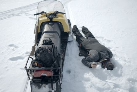 Joel Jacko sets a fishing line in the frozen lake. (National Geographic/Wayne Shockey)