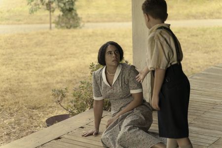 Louise, played by Parisa Fitz-Henley, is helped up by her son Malcolm, played by Mason Lowery, in GENIUS: MLK/X. (National Geographic/Richard DuCree)