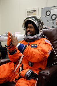 STS-122 Mission Specialist Leland Melvin tests his gloves for a final fitting before space shuttle Atlantis' launch. Atlantis will carry the Columbus Lab, Europe’s largest contribution to the construction of the International Space Station. It will support scientific and technological research in a microgravity environment. Columbus, a program of ESA, is a multifunctional, pressurized laboratory that will be permanently attached to Node 2 of the space station to carry out experiments in materials science, fluid physics and biosciences, as well as to perform a number of technological applications. (Photo credit: NASA/Kim Shiflett)