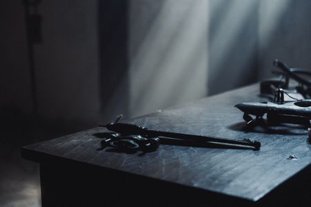 A multitude of torture devices resting on a table inside the prison cells. (Dash Productions Services LTD/Antoan Ivanov)