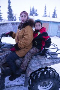 Wade Kelly with his mother, Iriqtaq Hailstone, heading to an elder's home to give away his first ptarmigan. (BBC Studios Reality Productions, LLC/Ashton Hurlburt)