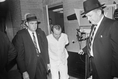 Police officers escort Jack Ruby, killer of accused presidential assassin Lee Harvey Oswald, from the Dallas City Jail to a county facility in Texas. It was during just such a transfer that Ruby shot Oswald. (Bettmann Archive/Getty Images)