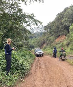 Mariana van Zeller and crew wait for their ride into the forest in the Democratic Republic of the Congo. (National Geographic for Disney)
