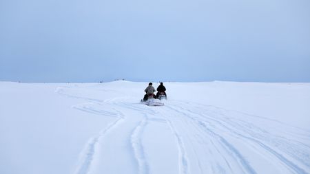 Avery and Gage Hoffman travel by snowmobile in the winter season, in search of moose. (BBC Studios Reality Productions, LLC/Jeffrey Alexander)