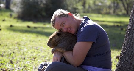 Holly hugging a beaver. (Big Wave Productions)