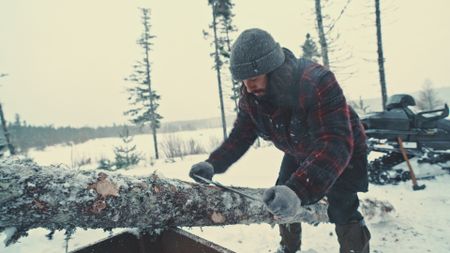 Matty prepares a log for his bedframe. (Blue Ant Media/Tara Elwood)