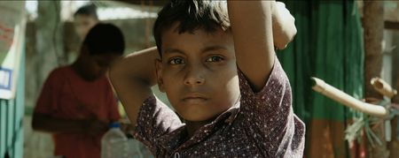 A boy in the Kutupalong Refugee Camp.  Lost and Found, directed by Academy Award winner Orlando von Einsiedel (“The White Helmets”, “Virunga"), is an inspiring story of humanity and heroism in the world’s largest refugee camp, that follows Kamal Hussein, a Rohingya refugee who has dedicated his life to reuniting children with their parents. (Nobel Media/Franklin Dow)
