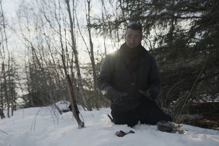 Joel Jacko hunts ptarmigan during the winter season for subsistence food. (National Geographic/Lauren Bird Dixon)