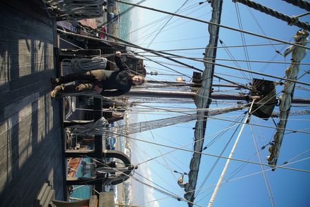 Claudio Lozano on the deck, by the wheel of a Punatles ship. The ship was used to defend against the french navy in the penninsular war in Spain. (National Geographic/Ciaran Henry)