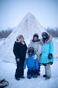 Agnes Hailstone ice fishing with her daughters Tinmiaq and Qutan, and her grandson Sabastian Hailstone.(BBC Studios Reality Productions, LLC/Pedro Delbrey)