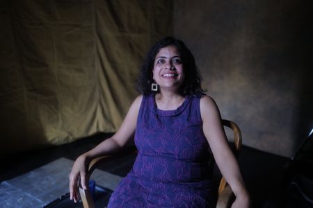 Cultural Historian Dr. Diya Gupta is photographed on set during an interview for "Erased: WW2's Heroes of Color." (National Geographic/Daniel Dewsbury)