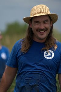 Gardner Goodall, Native Plants Program Coordinator from the Coalition to Restore Coastal Louisiana, laughs while teaching the volunteers. (National Geographic/Brian Roedel)