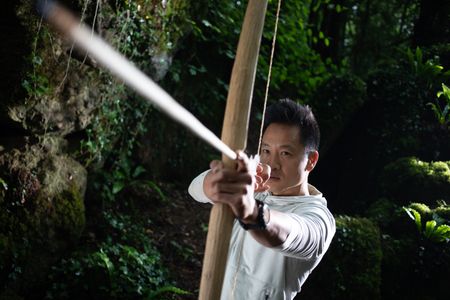 Coleford, UK - Albert Lin with bow and arrow. (National Geographic/Hugh Campbell)