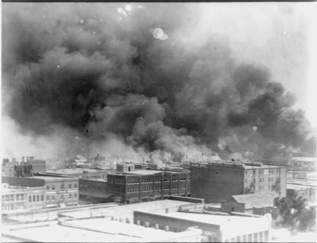 Smoke billowing from burning buildings during the Tulsa Race Massacre. (Library of Congress/Public Domain)