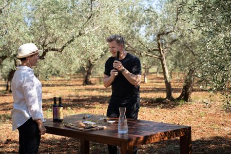 Croatia - Gordon Ramsay (R) samples local olive oil with expert, Lena, in Croatia. (Credit: National Geographic/Justin Mandel)