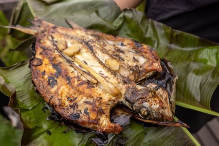 Close-up of cooked Ikan Semah dish wrapped in leaves. (Credit: National Geographic/Annice Lyn)