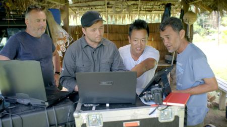 Albert Lin and the team discuss LiDAR results. (National Geographic/Pete Allibone)