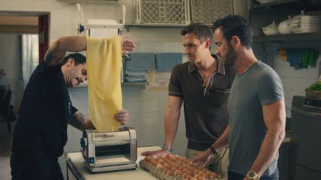 Fabio Delledone shows Antoni Porowski and Justin Theroux how to make tortelli at Ristorante Belrespiro. (National Geographic)