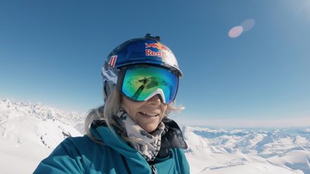 Angel Collinson films herself on top of an Alaskan mountain beforee she skis it down.  (mandatory credit:  Matchstick Productions/Angel Collinson)