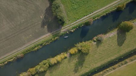 An aerial view of Alex Churchill paddling a canoe on The Royal Military Canal. (National Geographic)