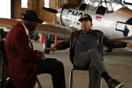 Tuskegee Airman LT. COL. (RET) James H. Harvey chats with Tuskegee Airman LT. COL. (RET) Harry T. Stewart at The Tuskegee Airmen National Museum in Detroit. (National Geographic/Rob Lyall)