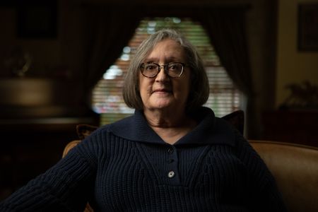 Fran Ferrari is pictured in close-up portrait during the production of National Geographic's Oklahoma City Bombing: One Day In America. Ferrari was at work in the Journal Record building located across the street from the Alfred P. Murrah building and was seriously injured when the explosion shattered the large window in front of her desk. On April 19, 1995, America experienced the deadliest domestic terror attack in its history. Thirty years later, this series tells the story of that day told only by those who lived through it – the people of Oklahoma.  (National Geographic/Brandon Widener)