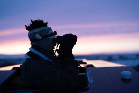 Sue Aikens is on the lookout for ptarmigan and rabbits as an opportunity to gather subsistence food during the winter season. (BBC Studios Reality Productions, LLC/Jayce Kolinski)