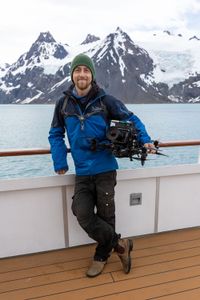 Drone operator Raphael Boudreault-Simard stands with a drone in the Southern Ocean. (National Geographic for Disney/Ruth Davies)