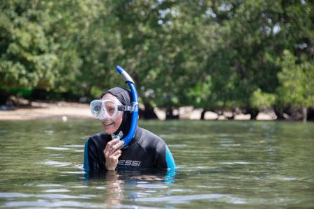 Octopus researcher, Dr. Crissy Huffard, on a scouting snorkel for Algae octopus (Abdopus aculeatus) in Bunaken Marine Park.  (photo credit: National Geographic/Annabel Robinson)