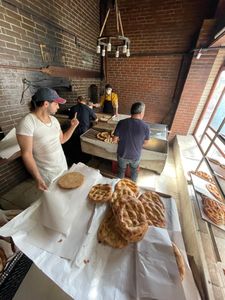 Master Baker Sami Eryılmaz and his assistants make Ramadan Pide at his Tophane Tarihi Tas Firin bakery in Istanbul. The traditional bread is consumed to break the fast during the month-long holiday. (National Geographic/Madeline Turrini)
