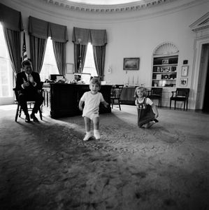 President John F. Kennedy claps while his son John Jr. and daughter Caroline play in the Oval Office at the White House, Oct. 10, 1962, in Washington, D.C. (Cecil Stoughton/John F. Kennedy Presidential Library and Museum, Boston)