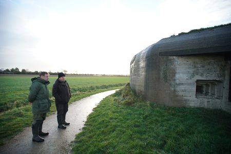 Andy Torbert outside German bunker on Walcheren Island. (National Geographic/Ciaran Henry)