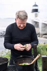 Maine - Gordon Ramsay adds basil to his clam and lobster stew. (Credit: National Geographic/Justin Mandel)