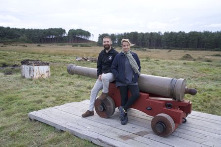 Alex Churchill poses por a portrait with Rob Bibbings of the Trafalgar Gun Company, after firing a replica canon of the type used on HMS Victory during the Battle of Trafalagar. (National Geographic/Jahlani Clarence)